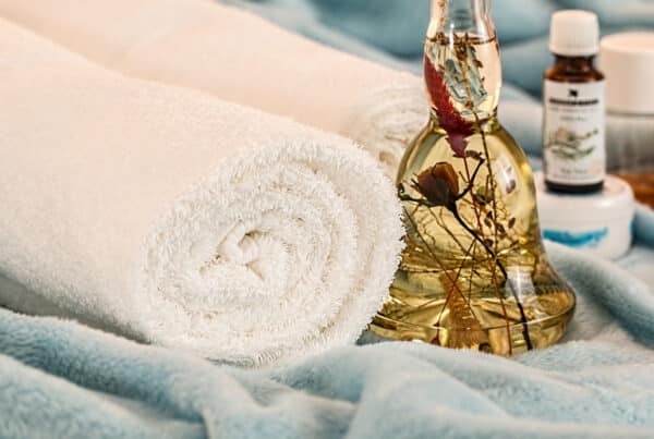 massage therapy essential oils at a spa with a towel