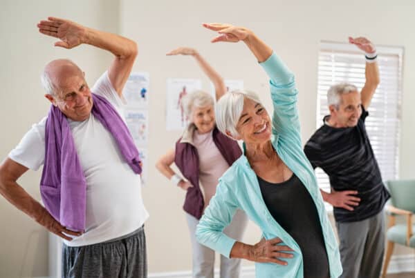 seniors exercising at assisted living facility