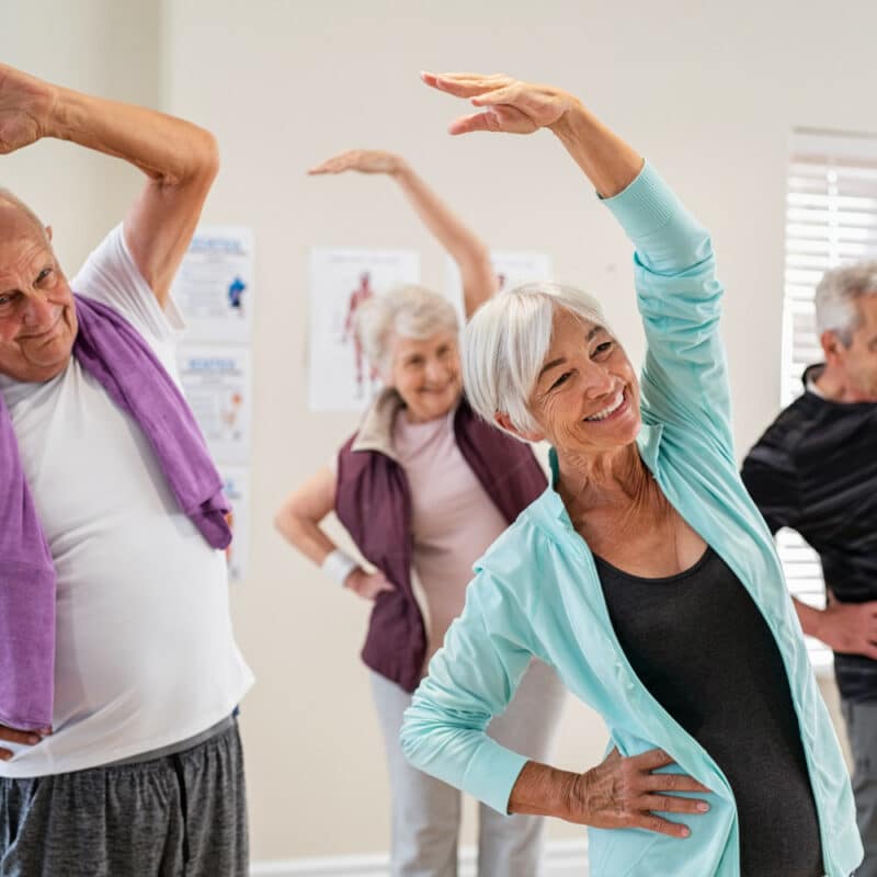 seniors exercising at assisted living facility