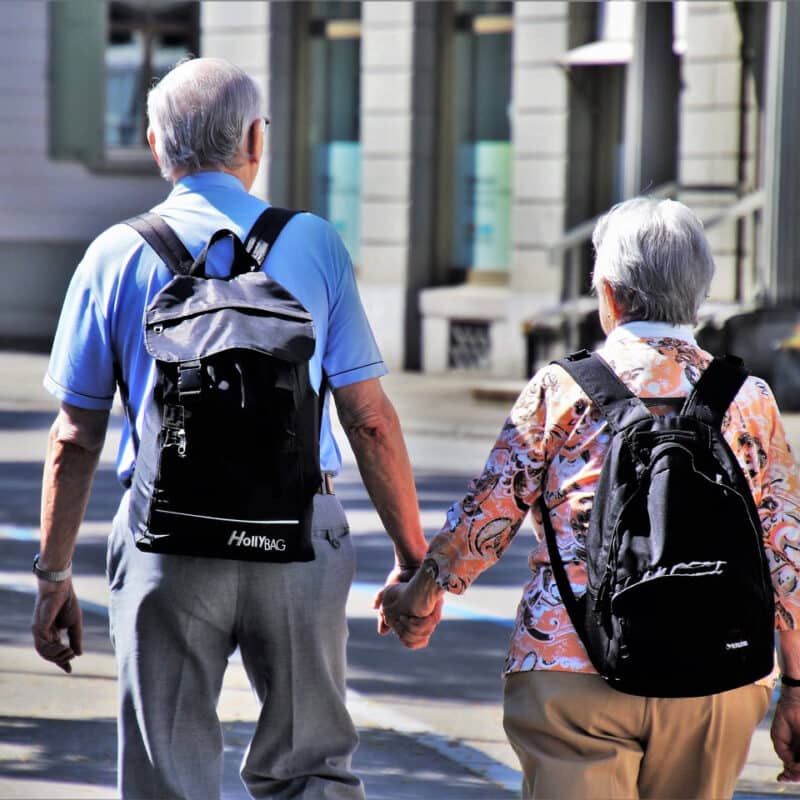 seniors holding hands
